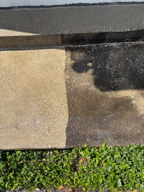 Clean concrete sidewalk after pressure washing